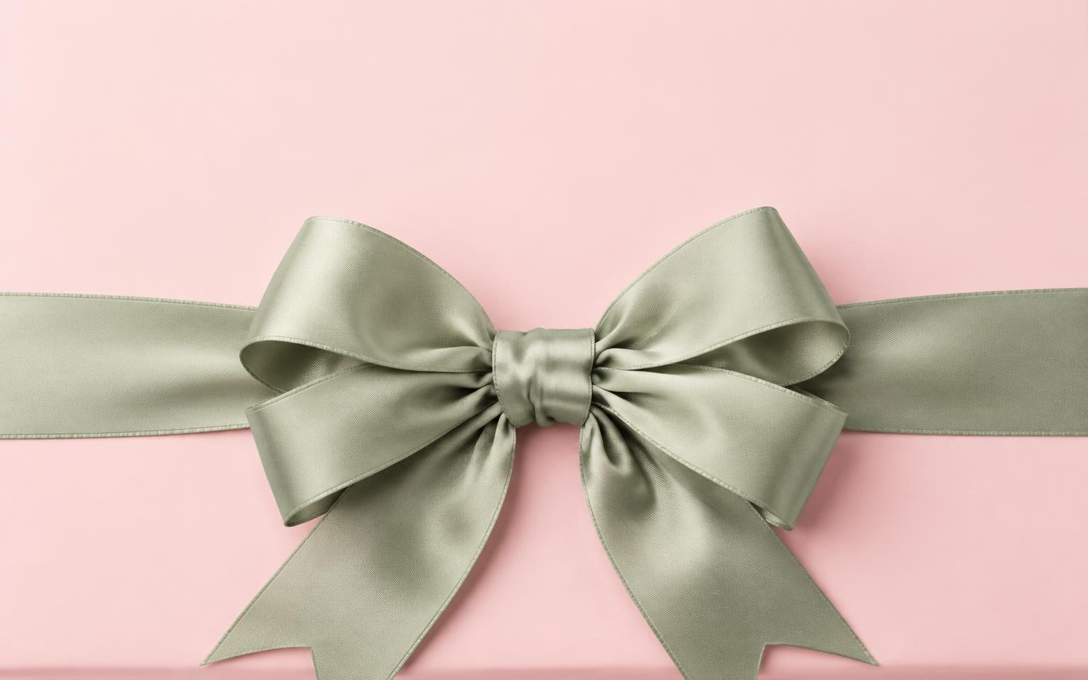 Satin ribbon and bow on a blush gift box